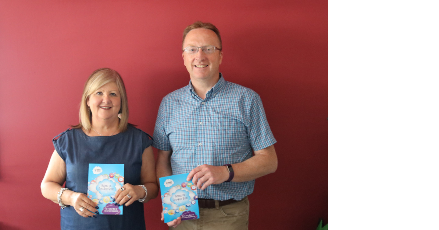 Margaret Yarr, Child Protection Officer for Northern Ireland, and Dr Peter Hamill, Secretary to the Church of Ireland Safeguarding Board, with the new guidelines leaflet for faith–based groups on the use of social media and other online communication.
