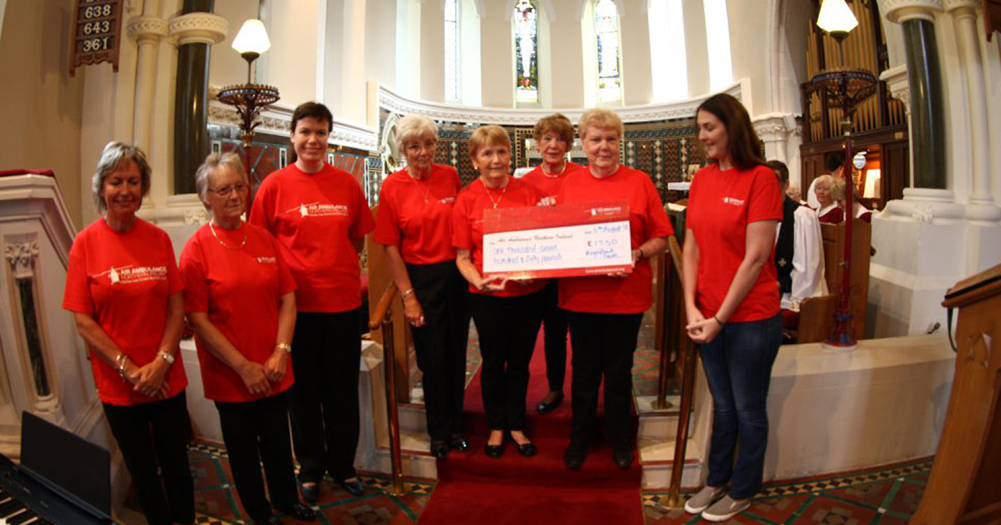 Grace Williams, area fundraiser for Air Ambulance Northern Ireland, right, was at All Saints’, Eglantine, on August 5 to collect a cheque from ‘The Magnificent Seven’ who competed in the Belfast Fun Run last May. Organiser Alison Leckey is second from right in the picture.