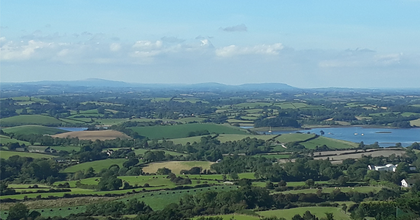 The County Down countryside, along the shores of Strangford Lough, rolls out from Slieve Patrick.