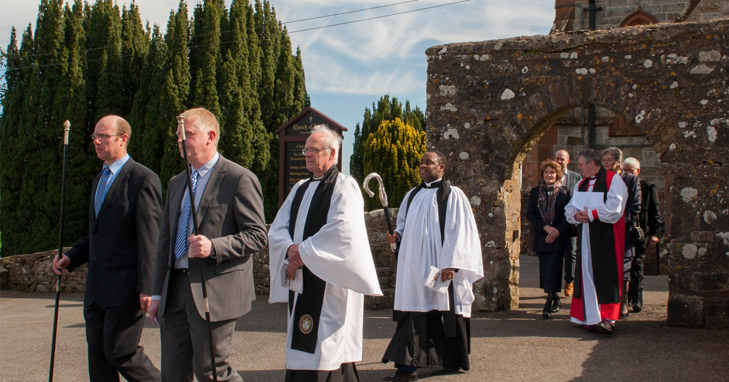 Churchwardens Colin Ferguson and David Ferguson leading the procession from Devenish Parish Church to the Reade Hall with Canon David Skuce, the Revd Sampson Ajuka, and the Bishop of Clogher, the Right Revd John McDowell, and guests.
