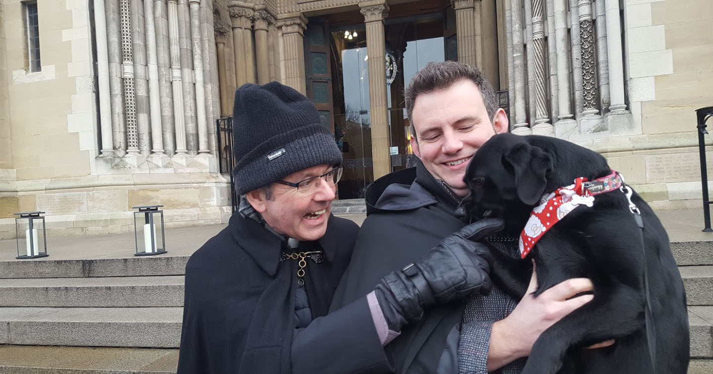 Flashback to December 2018 when the Rev Ian Mills and his dog Xena joined Dean Stephen Forde on the steps of Belfast Cathedral for the Black Santa Sit–out. The 2018 appeal raised £160,000.
