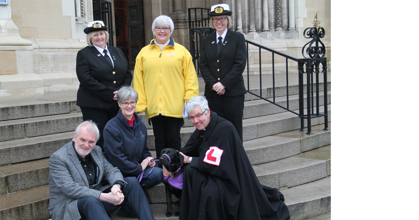 At the Good Samaritans Service at Belfast Cathedral are, back row from left: Lesley Hammond, Fishermans’ Mission; Grace Koch, SOS Bus; and Ingrid Perry, Fishermans’ Mission. Front, from left: actor and comedian Tim McGarry, who was special guest at the service; Penny Stanley, Assistance Dogs NI with Gracie; and the Dean of Belfast, the Very Rev Stephen Forde.
