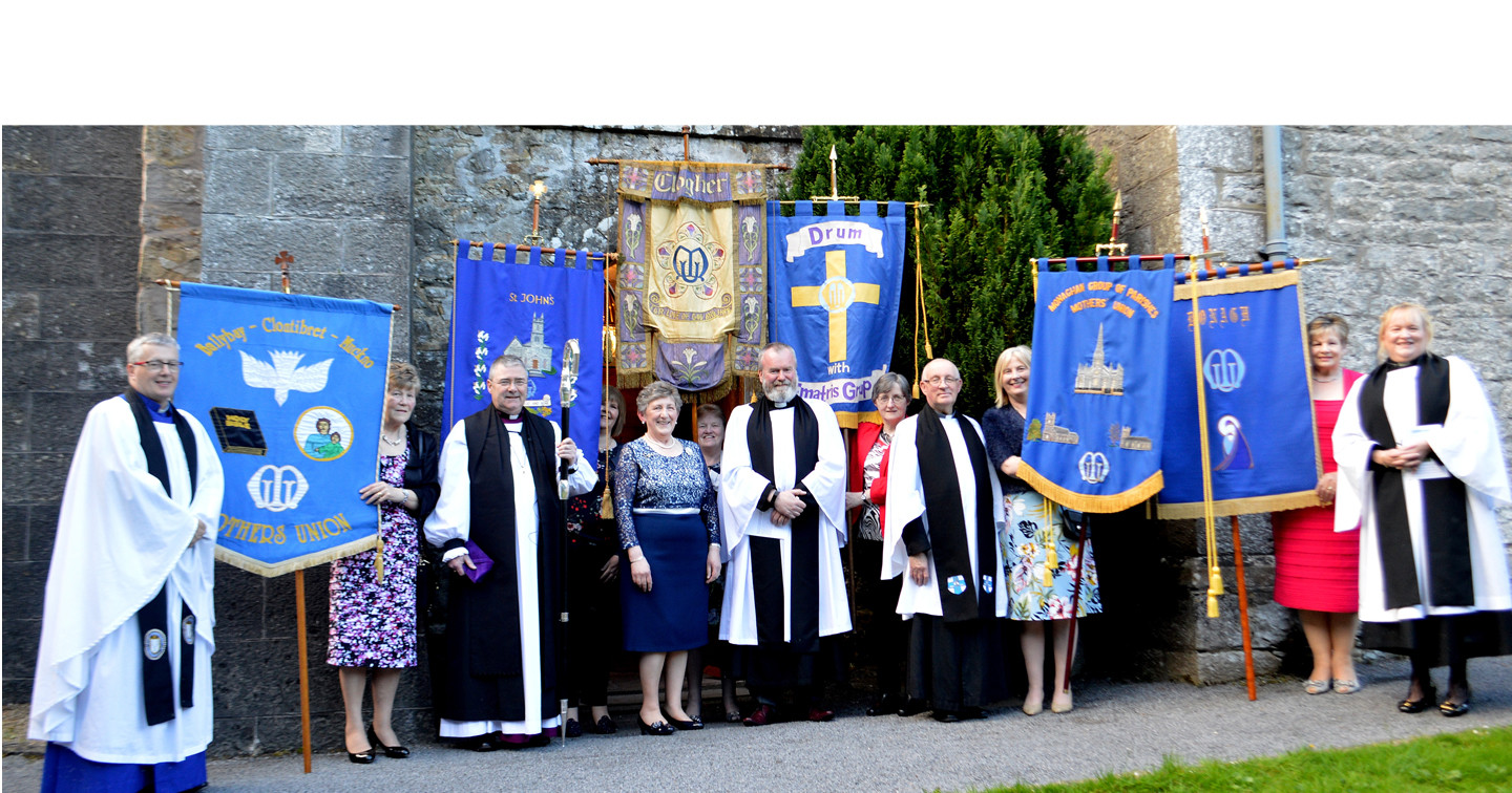 The Revd Charles Eames (centre), the new Clogher Diocesan Mothers’ Union Chaplain, with the Bishop of Clogher, the Right Revd John McDowell; Dean Raymond Ferguson, Mothers’ Union All–Ireland Chaplain; Archdeacon Brian Harper, the Revd Lorraine Capper and Mrs Irene Boyd, Clogher Diocesan Mothers’ Union President, along with banner carriers from branches attending the Commissioning Service in St Salvator’s Parish Church, Donagh, Co. Monaghan. Photo by Valerie McMorris.