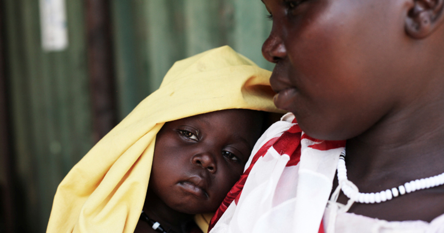 A mother with her 12–month old daughter who has been diagnosed with severe acute malnutrition.  Photograph courtesy of Andeea Campeanu/Christian Aid.