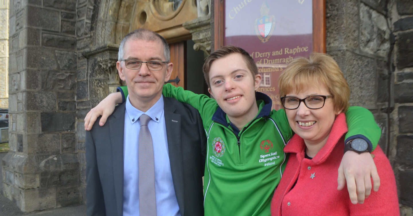 Team Ireland Special Olympian Lee Mitchell with his dad, David, and mum Laura, outside St Columba's Church in Omagh.