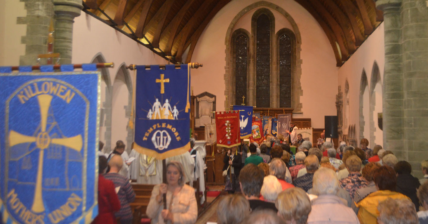 Members of the various Mothers' Union branches in Derry and Raphoe process into St Eunan's Cathedral, Raphoe, with their banners.