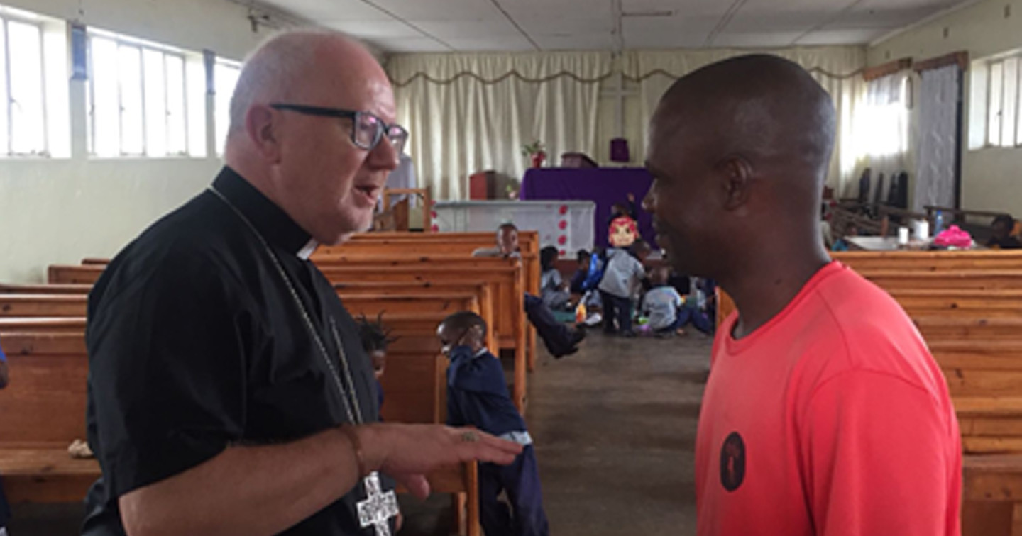 Archbishop Richard chats with Father Kelvin, parish priest of St John’s, Chingola.