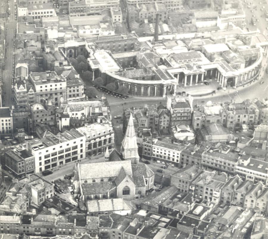 Aerial photograph of St Andrew's Church showing its proximity to the former Irish Houses of Parliament, by Irish Air Views c 1950, RCB Library photographic collection