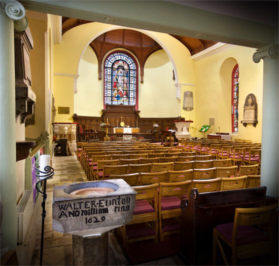 The interior of St Anne's Church in Shandon, with the original baptismal font from 1629 in the foreground. Photo: Michael Foley