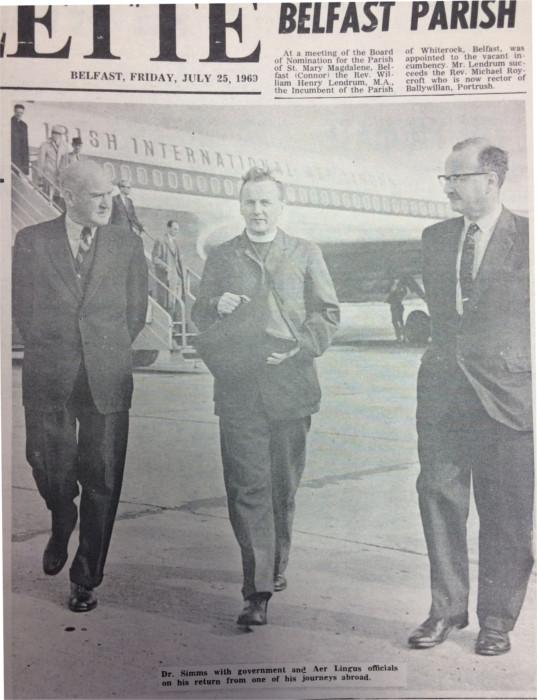 Archbishop Simms is escorted from plane by Aer Lingus officials, following one of his trips abroad, 25 July 1963