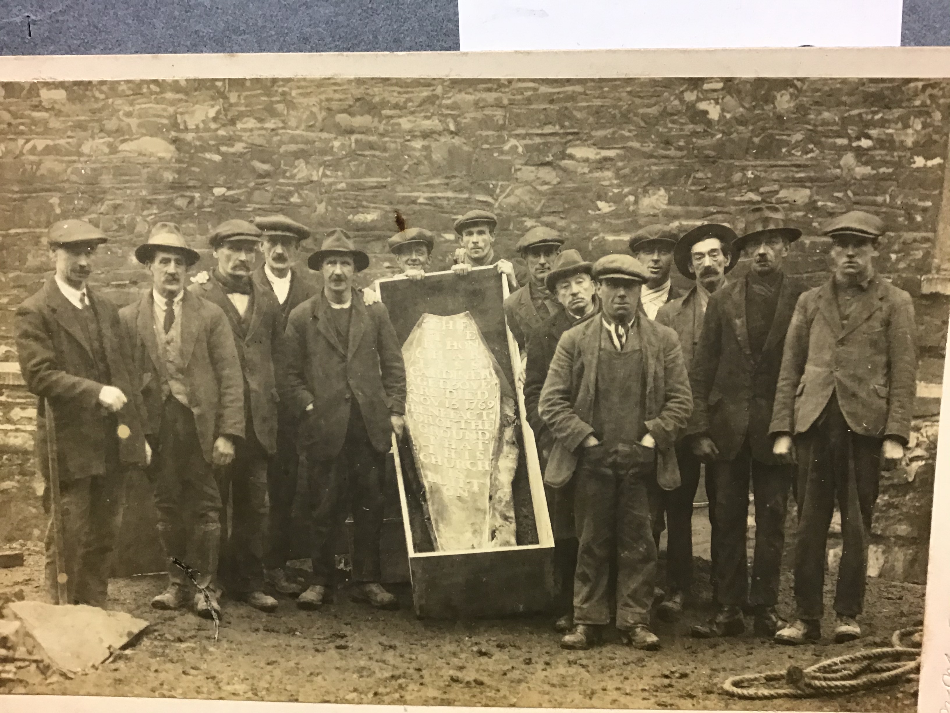 Another photograph of the tombstone of the Rt Hon Charles Gardiner, presumably showing some of the workmen employed for the task, as well as the ever-present Mr Purdon. RCB Library P.80.27.6