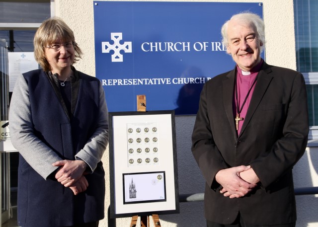 Dr Susan Hood, Librarian and Archivist at the RCB Library, and Archbishop Michael Jackson with the framed first day cover of the Disestablishment Stamp.