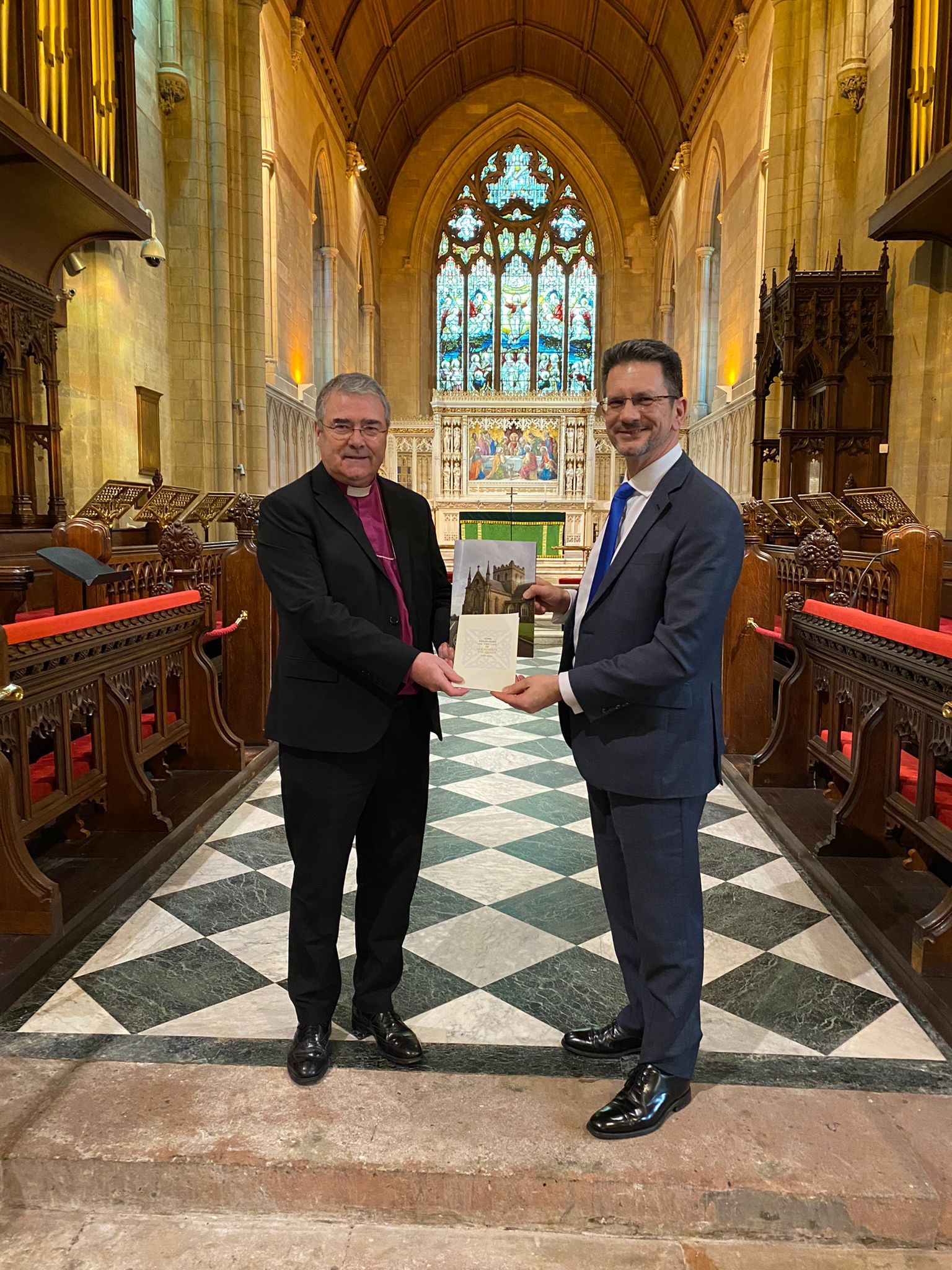 The Archbishop of Armagh, the Most Revd John McDowell with the Minister of State, Steve Baker MP.