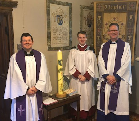 The Dean of Clogher, the Very Revd Kenneth Hall (right), from St Macartin's Cathdral with the Revd Chris MacBruithin, Curate, and Scott Elliott with the Eco Candle.
