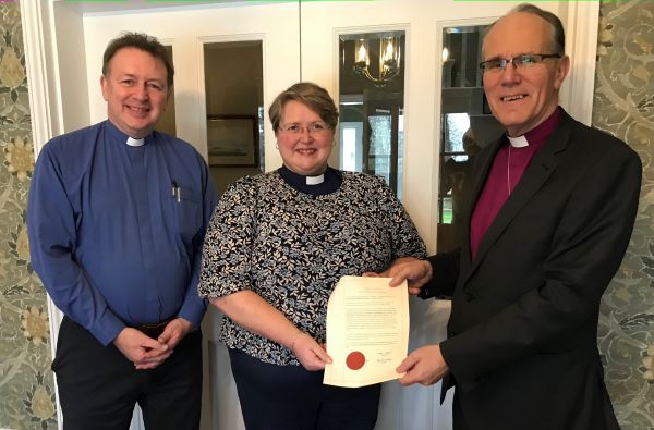 The Revd Alison Irvine receiving her licence from Bishop Ian Ellis and the Revd John McClenaghan.