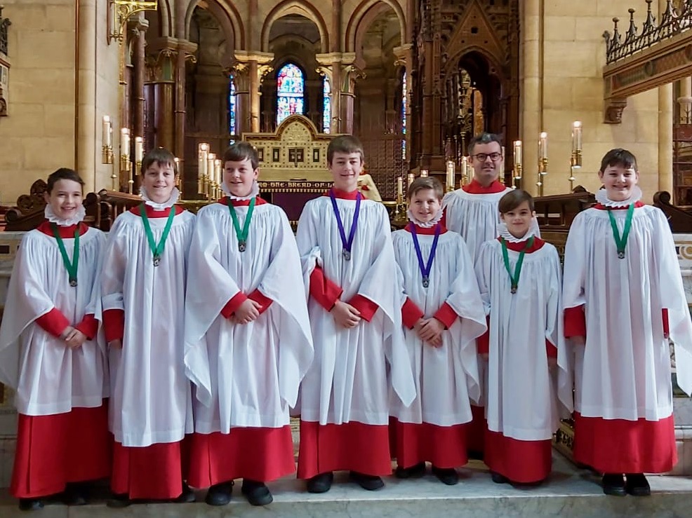 The seven choristers with their recent RSCM Awards, and with Mr Peter Stobart, Director of Music, St Fin Barre's Cathedral, Cork.