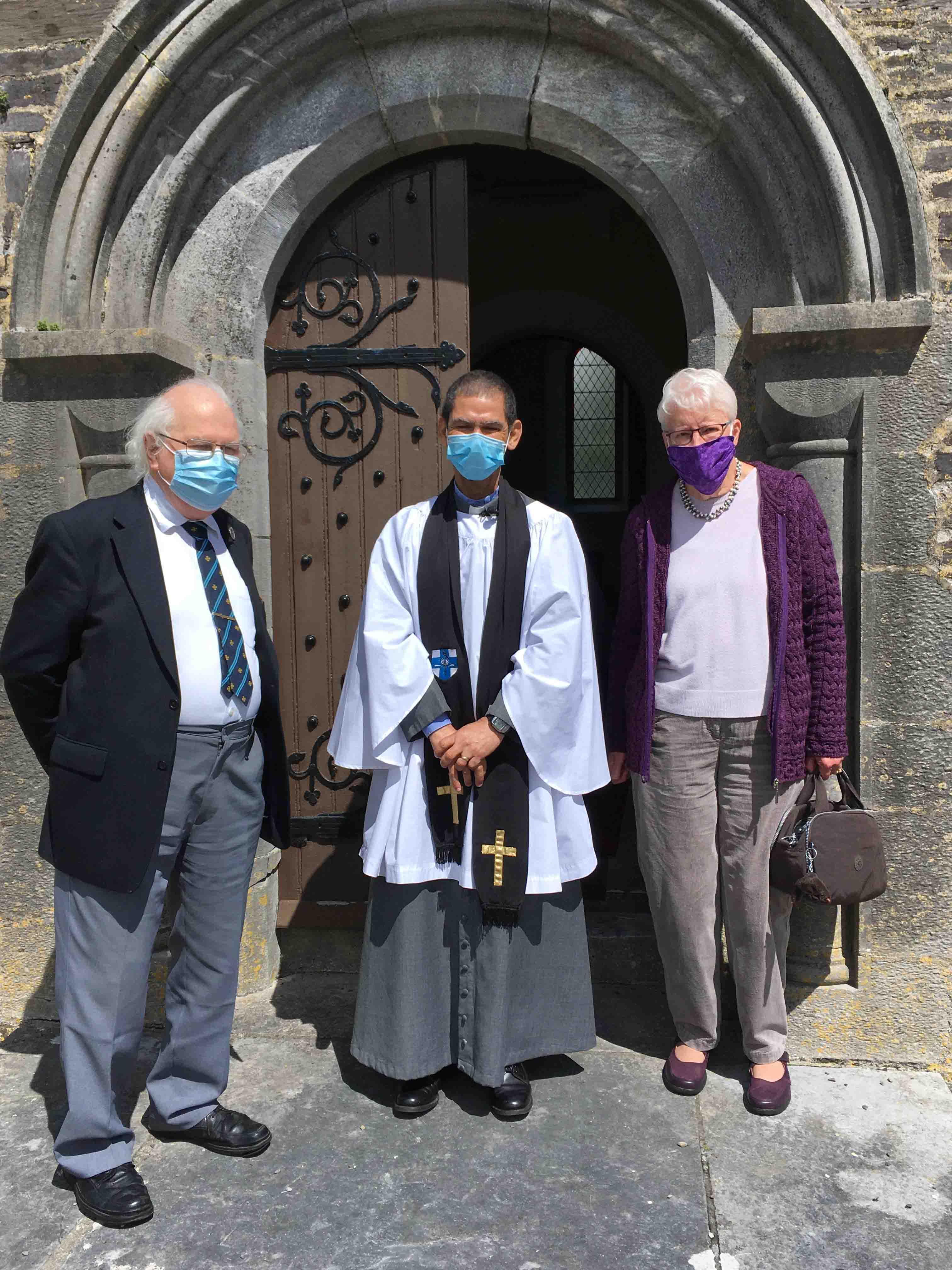 After the Service in Saint Bartholomew, Kinneigh, the Reverend Ivan Ruiters is pictured with David Bourne and Marjorie Garland.
