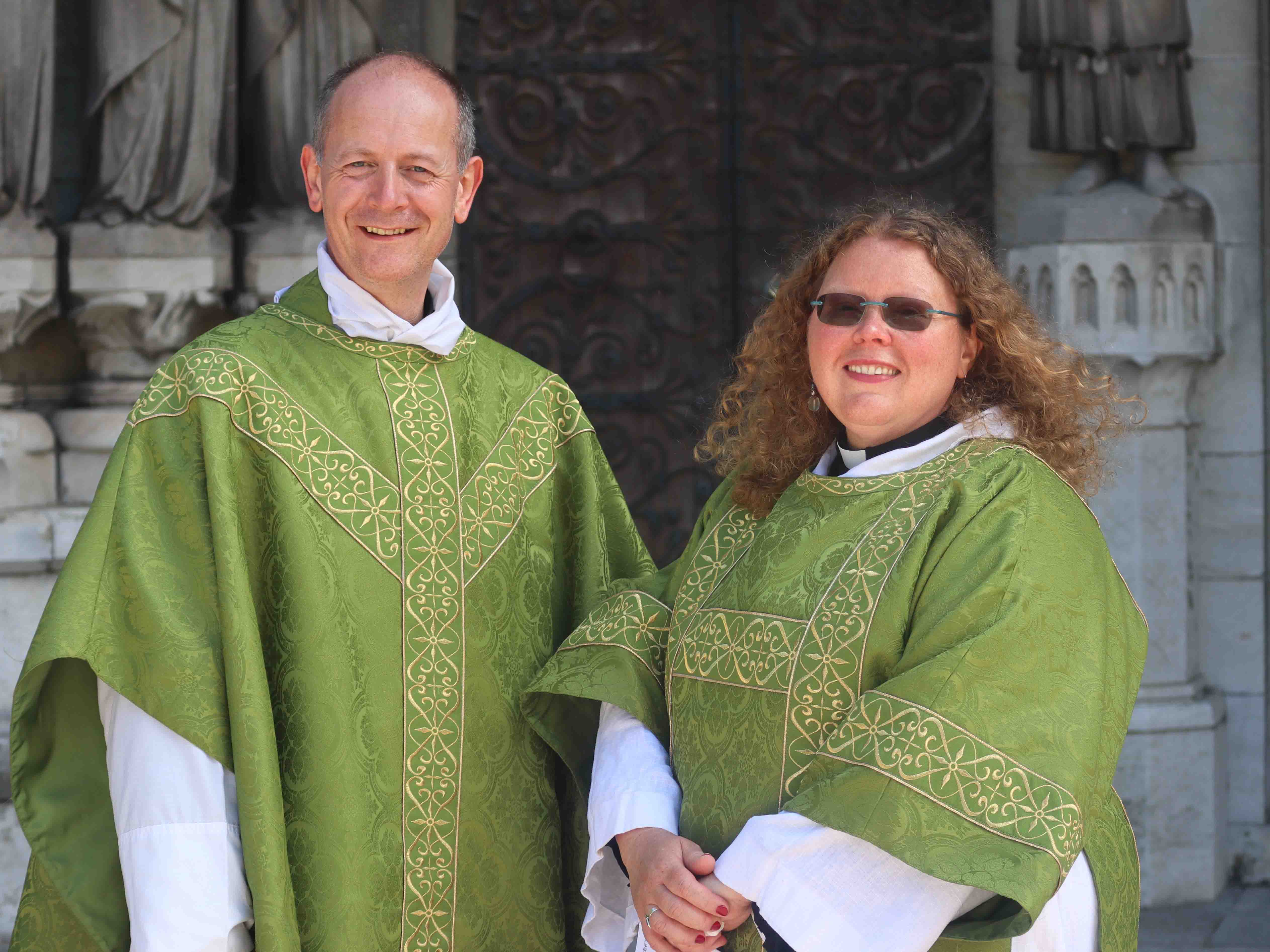 The Rev. Canon Dr Daniel Nuzum and the Rev. Julia Cody in front of St Fin Barre's Cathedral, Cork.