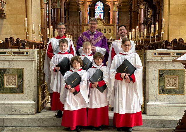 The new boy choristers with their Dean, the Very Rev. Nigel Dunne, their Director of Music, Peter Stobart, and the Assistant Director of Music, Robbie Carroll.