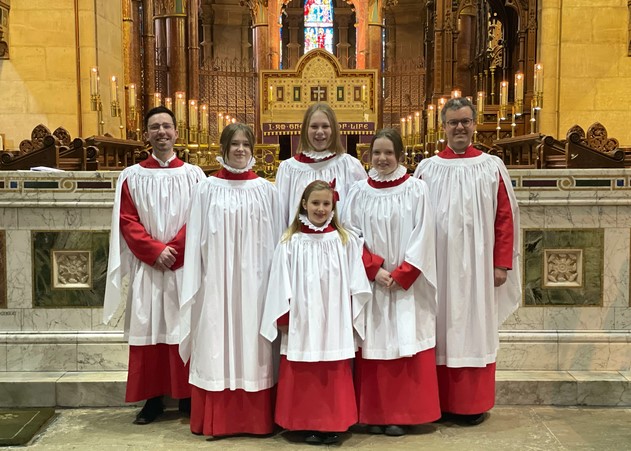The new girl choristers with their Director of Music, Peter Stobart, and the Assistant Director of Music, Robbie Carroll.