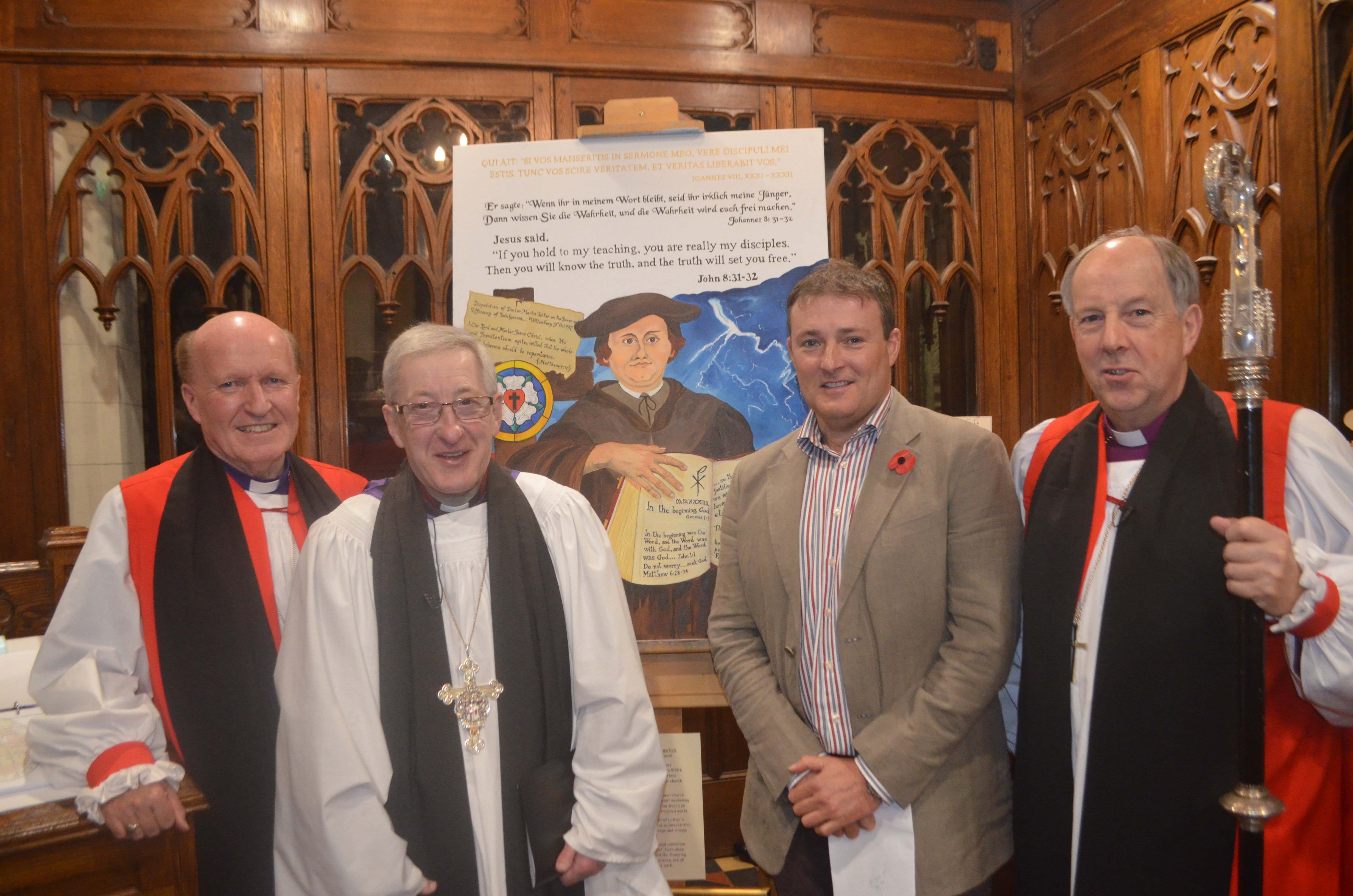 Bishop Ferran Glenfield, the Very Rev Raymond Stewart (Dean of Derry), artist Bruce Robinson and Bishop Ken Good alongside a portrait of Martin Luther which was displayed during the Diocese of Derry and Raphoe's Reformation Thanksgiving Service in St Columb's Cathedral.