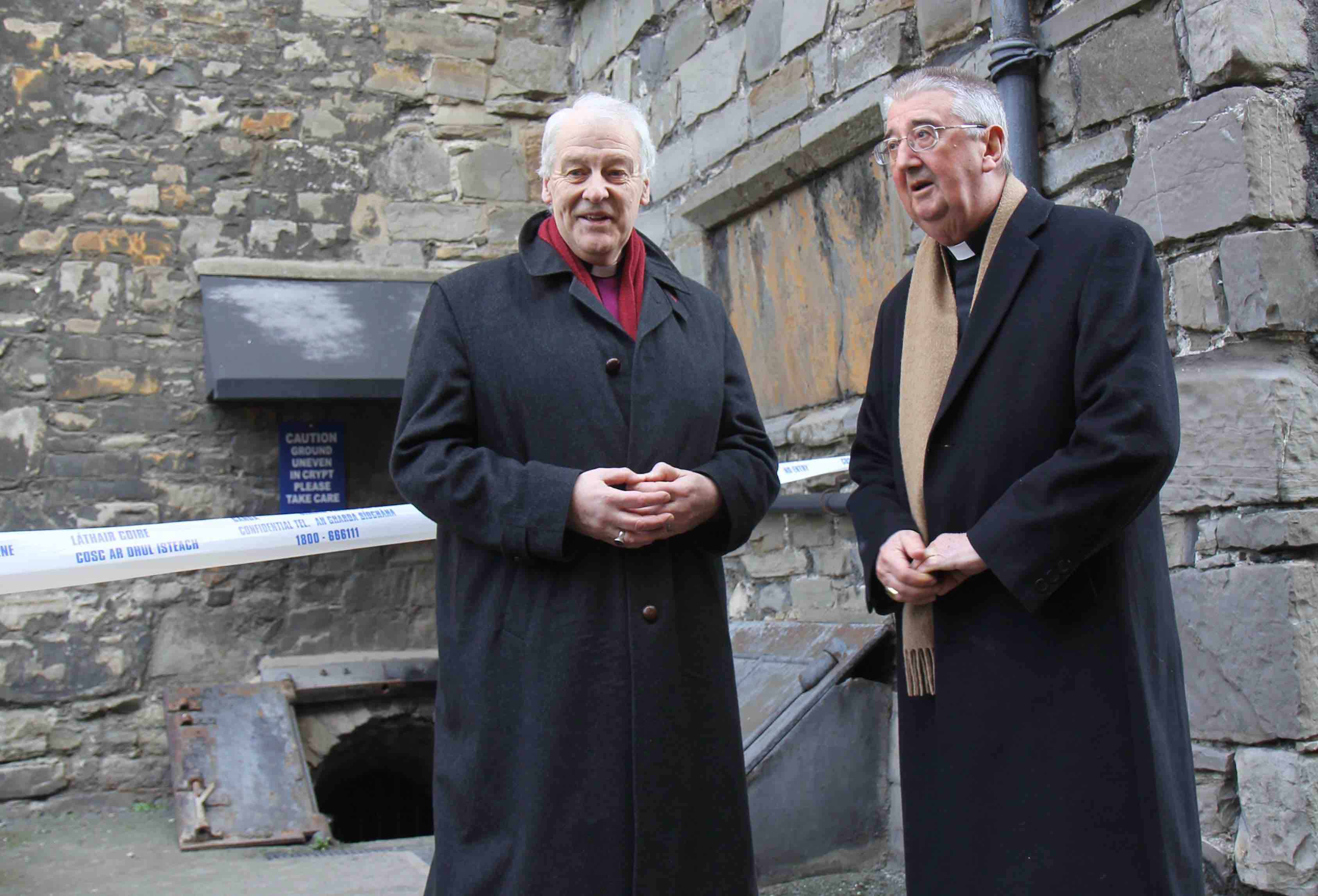 Archbishop Diarmuid Martin and Archbishop Michael Jackson at the entrance to the crypt of St Michan's Church.
