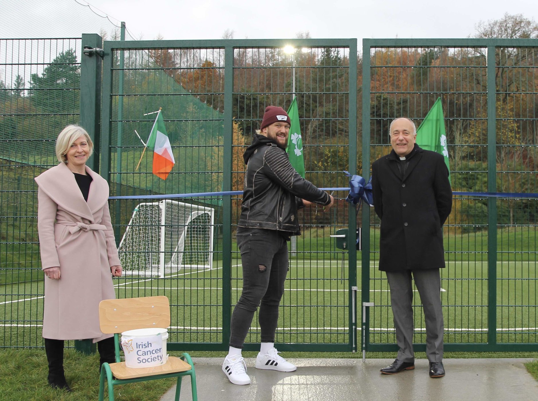 Ireland and Leinster Prop Andrew Porter cuts the ribbon on the new pitch at Blessington No 1 School. He is pictured with school principal Lillian Murphy and Rector of Blessington Canon Leonard Ruddock.