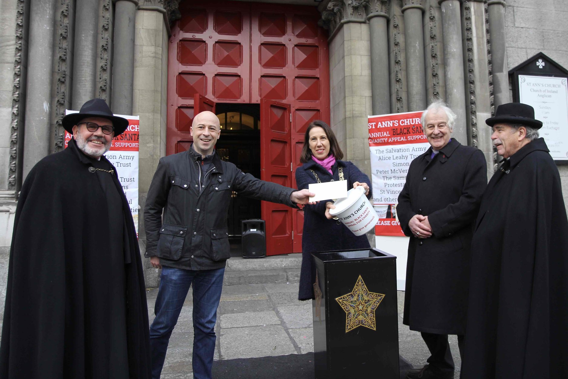 At the launch of the Black Santa Sit Out 2021 at St Ann's Dawson Street were Fred Deane, Derek Scully of Energia, Lord Mayor Allison Gilliland, Archbishop Michael Jackson and the Revd Terry Lilburn.