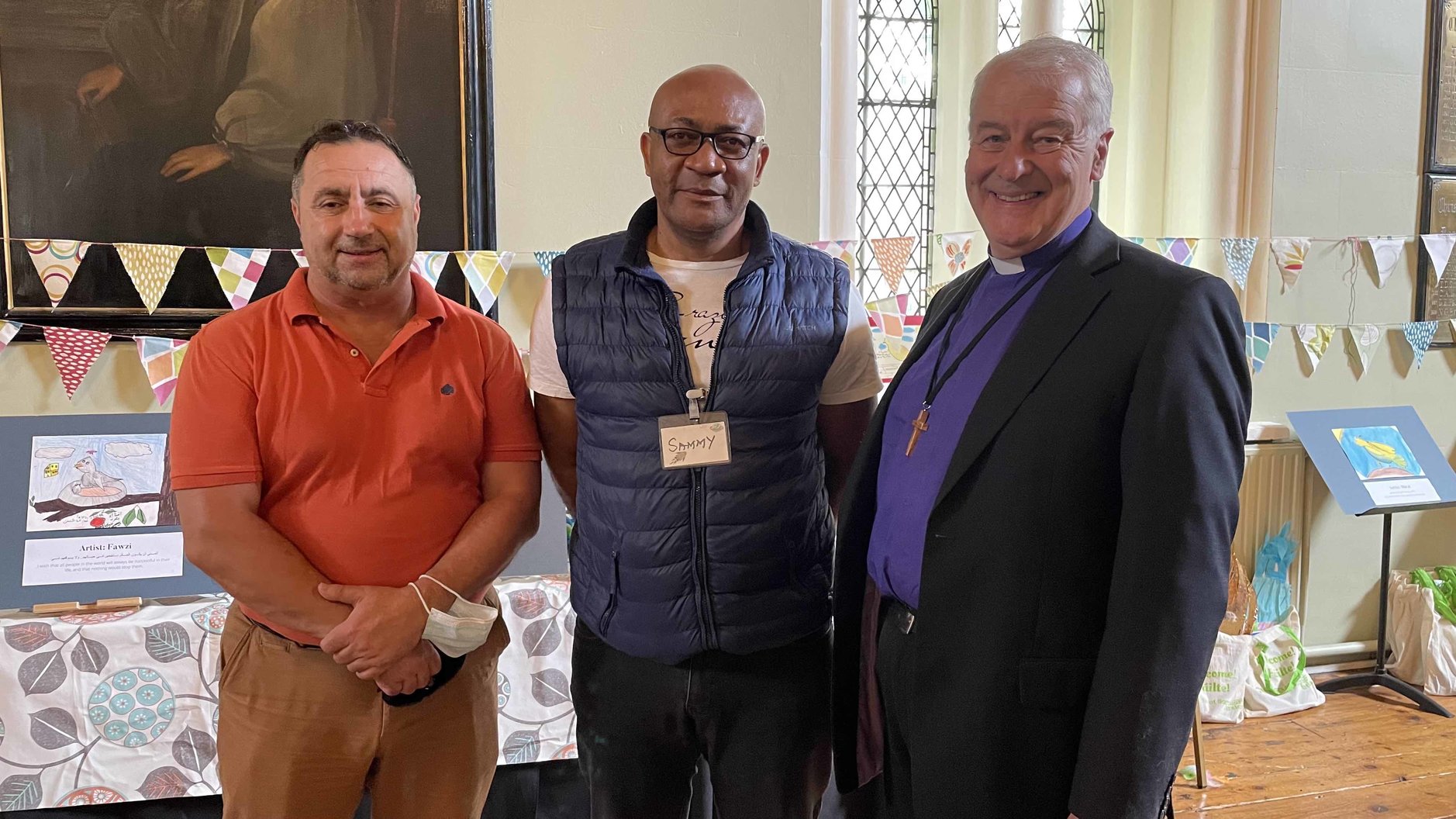 Archbishop Michael Jackson with Adrian Cristae of Dublin City Interfaith Forum and on of the camp volunteers, Sammy.