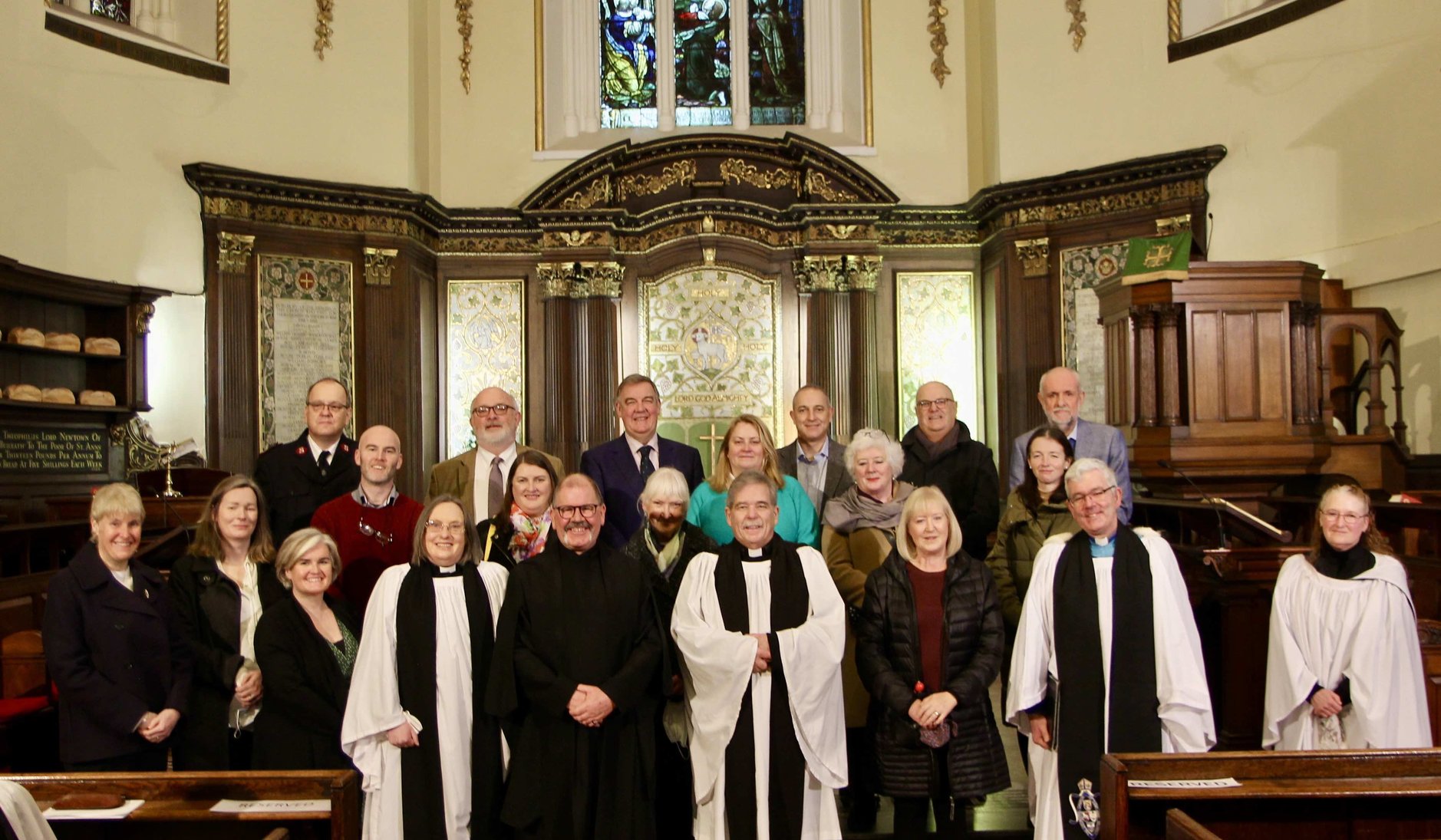 Representatives of the charities who benefited from the 2021 Black Santa Sit Out with clergy and staff of St Ann's and the Dean of Belfast. Masks were worn and removed for the photo.