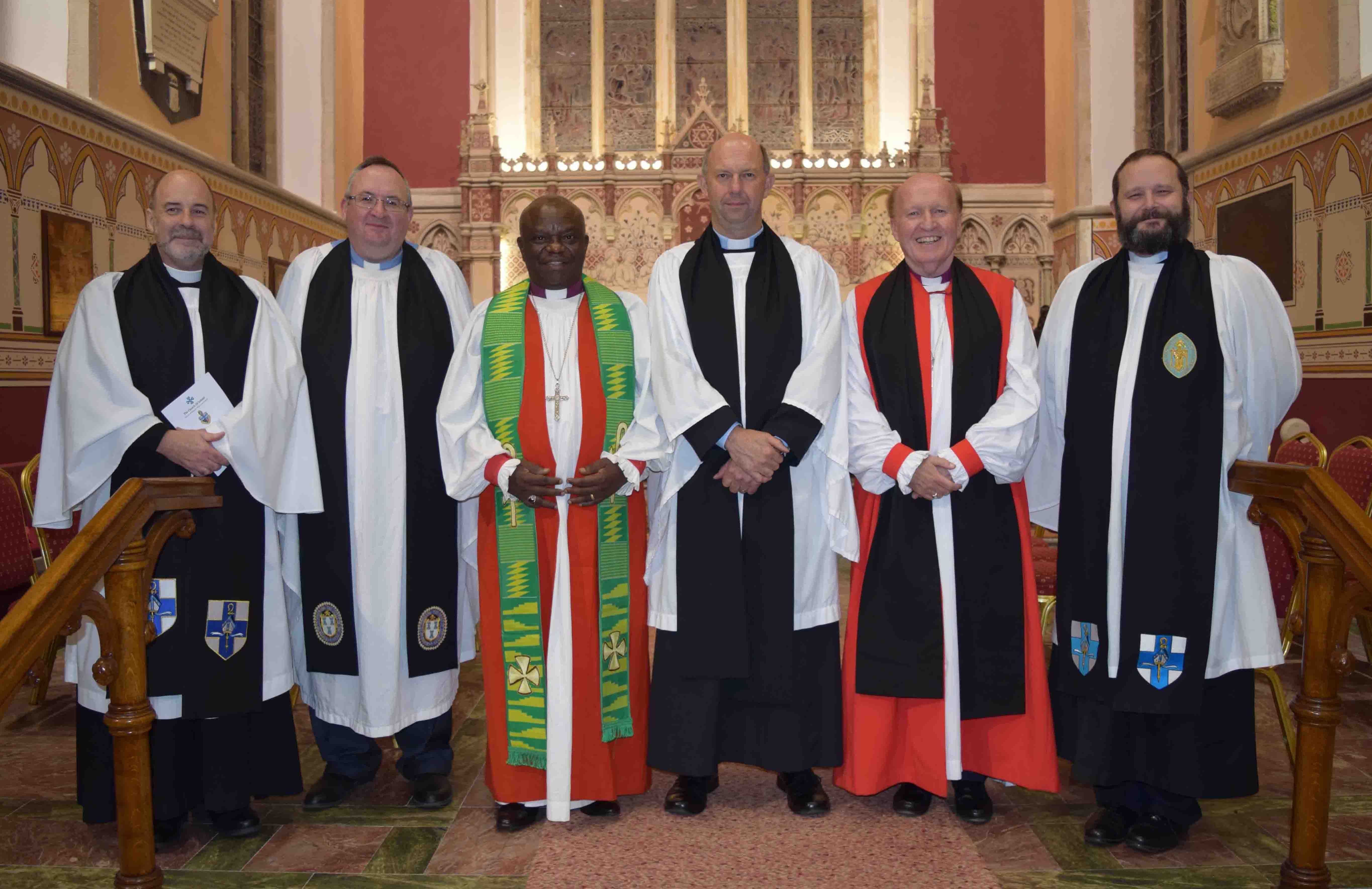 The Revd David Moses pictured with clergy at his ordination.