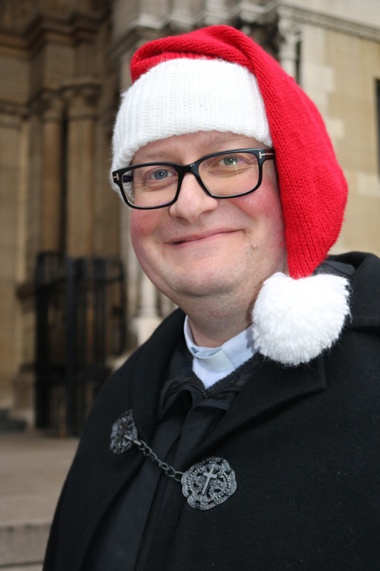 Canon Michael Parker gets into the Christmas spirit during his stint at Black Santa on Tuesday December 19.