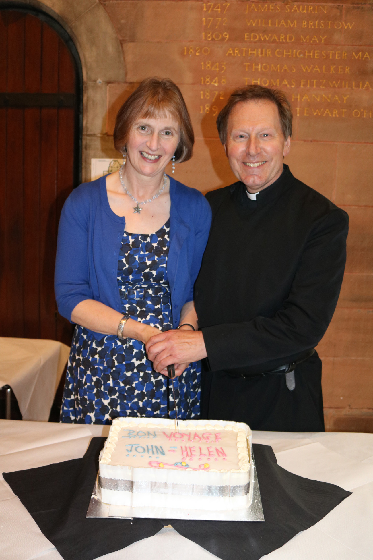 Dean John and Mrs Helen Mann prepare to cut the farewell cake at the reception which followed the Farewell Choral Evensong.