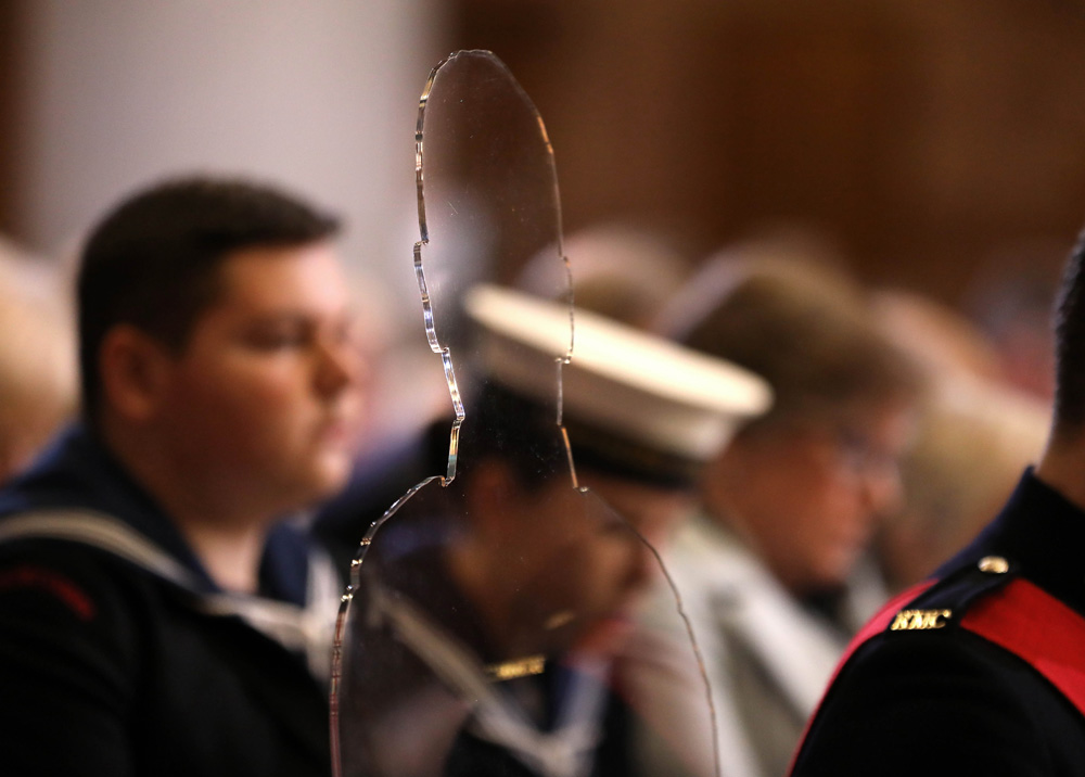 One of 10 perspex silhouettes occupying seats in the Cathedral, representing the 10 servicemen whose names were read out during the service. There but not there. Gone but not forgotten. ©Press Eye/Darren Kidd