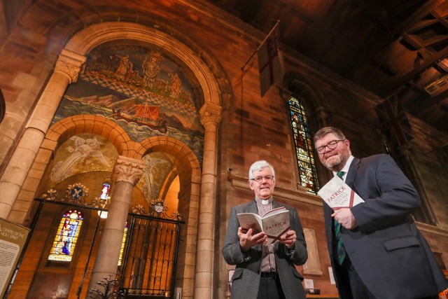 Chief Executive of the Ulster-Scots Agency, Ian Crozier with the Very Reverend Stephen Forde, Dean of Belfast, in front of the St Patrick mosaic in St Anne's Cathedral, Belfast.