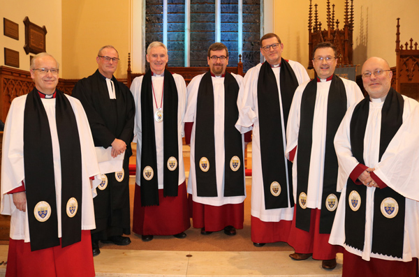 Members of the Chapter of St Saviour, Lisburn Cathedral, who were present for the installation of their newest Canon, the Rev Mark McConnell. From left: The Rev Canon Peter Galbraith, the Rev Canon William Taggart, the Dean of Connor, the Very Rev Sam Wright (rector of Lisburn Cathedral), the Rev Canon Mark McConnell, the Rev Canon James Carson, the Ven Paul Dundas and the Rev Canon Derek Kerr.