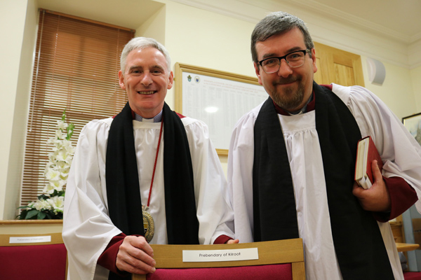 Dean Sam Wright introduces Canon Mark McConnell to his new seat as Prebend of Kilroot in the Chapter of St Saviour, Lisburn Cathedral.