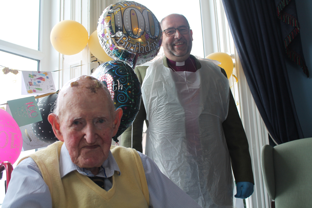 The Bishop of Connor, the Rt Rev George Davison, joins Clem Shaw for his 100th birthday party.