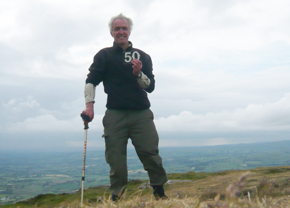 The Rev Canon Stuart Lloyd pictured on Slemish in June 2008, when he also climbed the mountain 50 times to raise funds for a church in Napal. He will take on the same challenge again from June 19-26.
