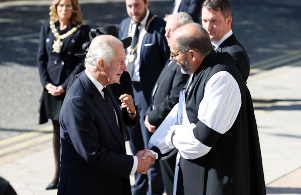 King Charles is greeted outside St Anne's Cathedral by the Bishop of Connor, the Rt Rev George Davison, who led the Service of Reflection on September 13. Photo by Kelvin Boyes/Press Eye.