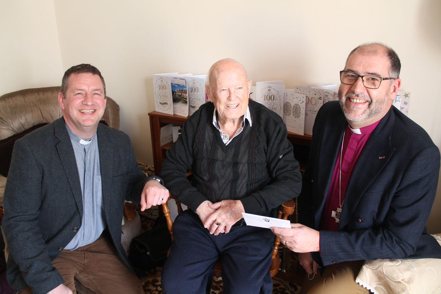 The Rev Dennis Christie (left), rector of Ahoghill and Portglenone, and the Bishop of Connor, the Rt Rev George Davison with birthday boy Nicky Anderson.