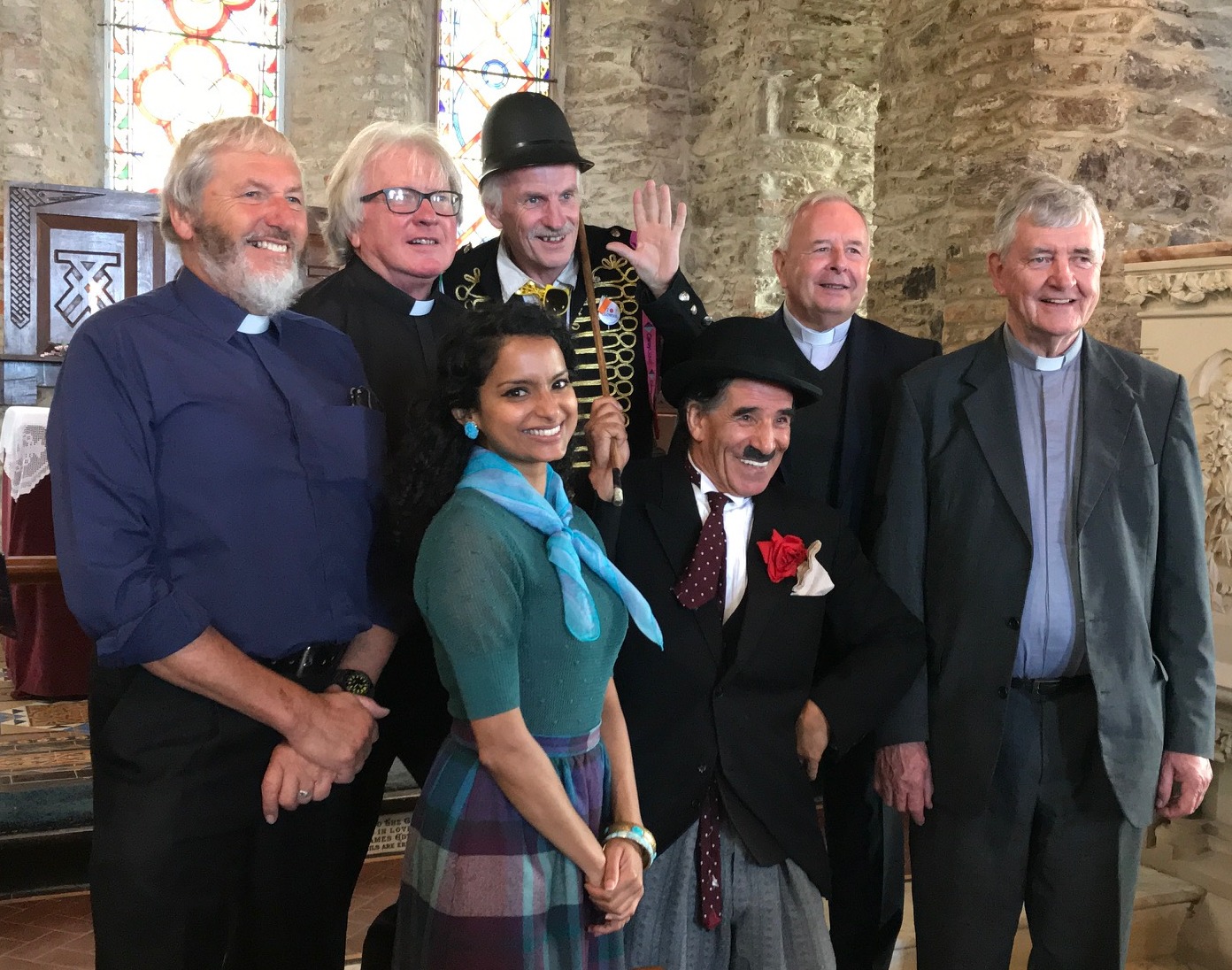 Left to right: The Revd Brian Rogers, the Revd Michael Cavanagh, an unnamed Keystone Cop, Fr Gerald Finucane and Fr Mike Curran with Charlie Pakdel and Lavinia De Silva. Photo by Marjory Cavanagh.
