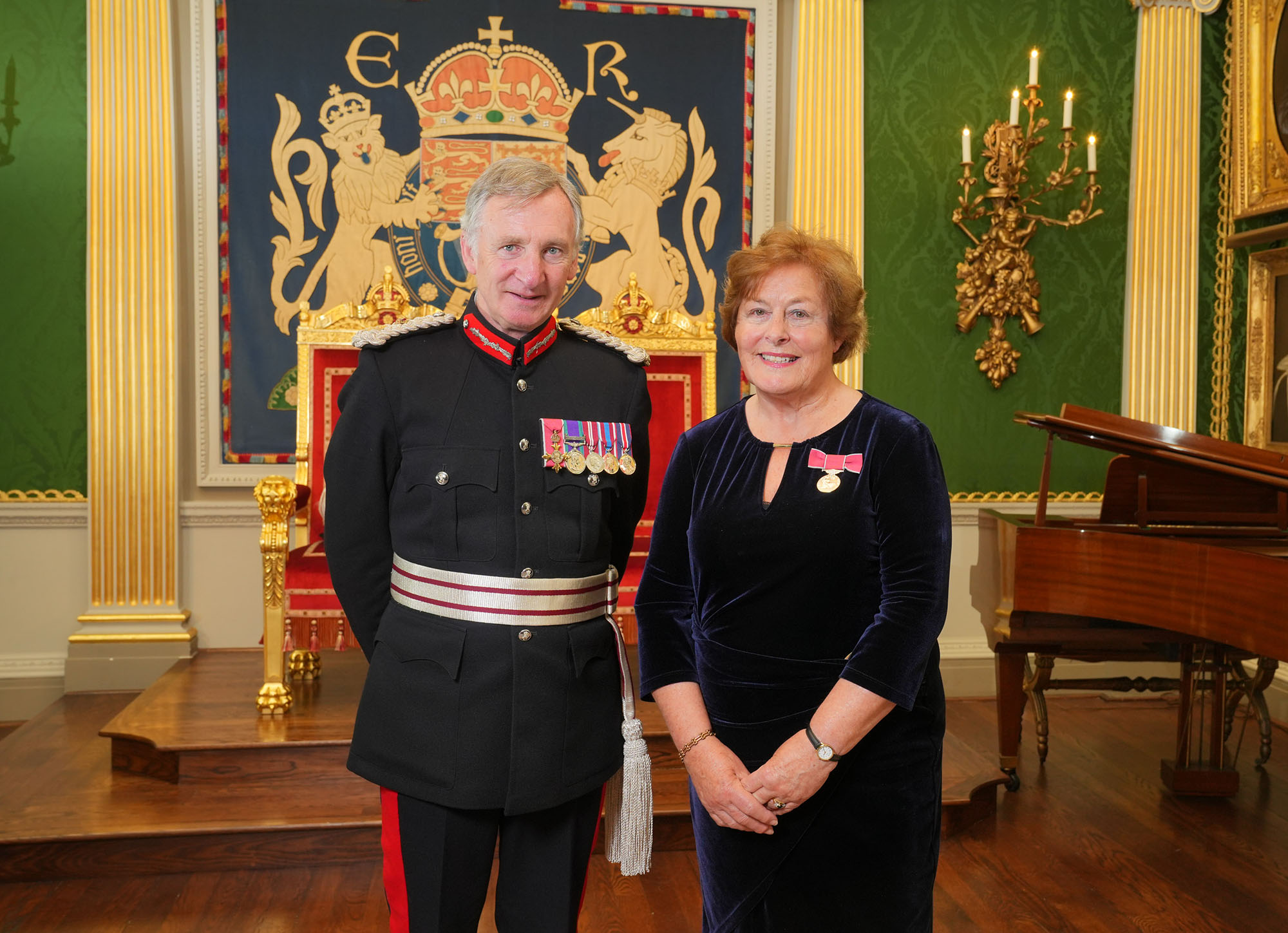 Mrs Joan Bruton BEM pictured receiving her award from Mr Robert Lowry Scott, His Majesty's Lord Lieutenant for Co. Tyrone, during a ceremony at Hillsborough Castle earlier this month.  Photo by Aaron McCracken.