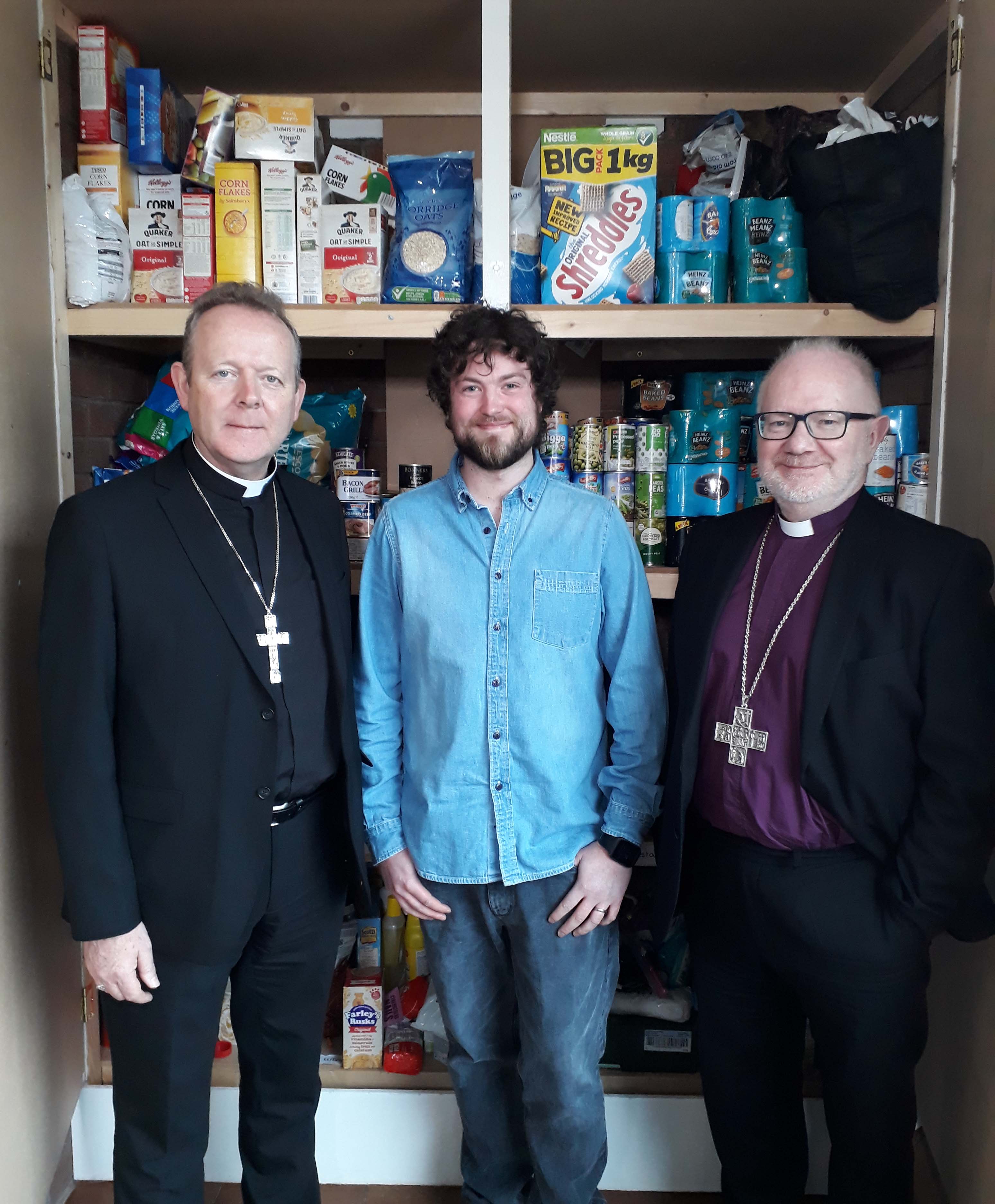 Archbishops Eamon Martin and Richard Clarke with David Nesbitt from the BCM food bank.