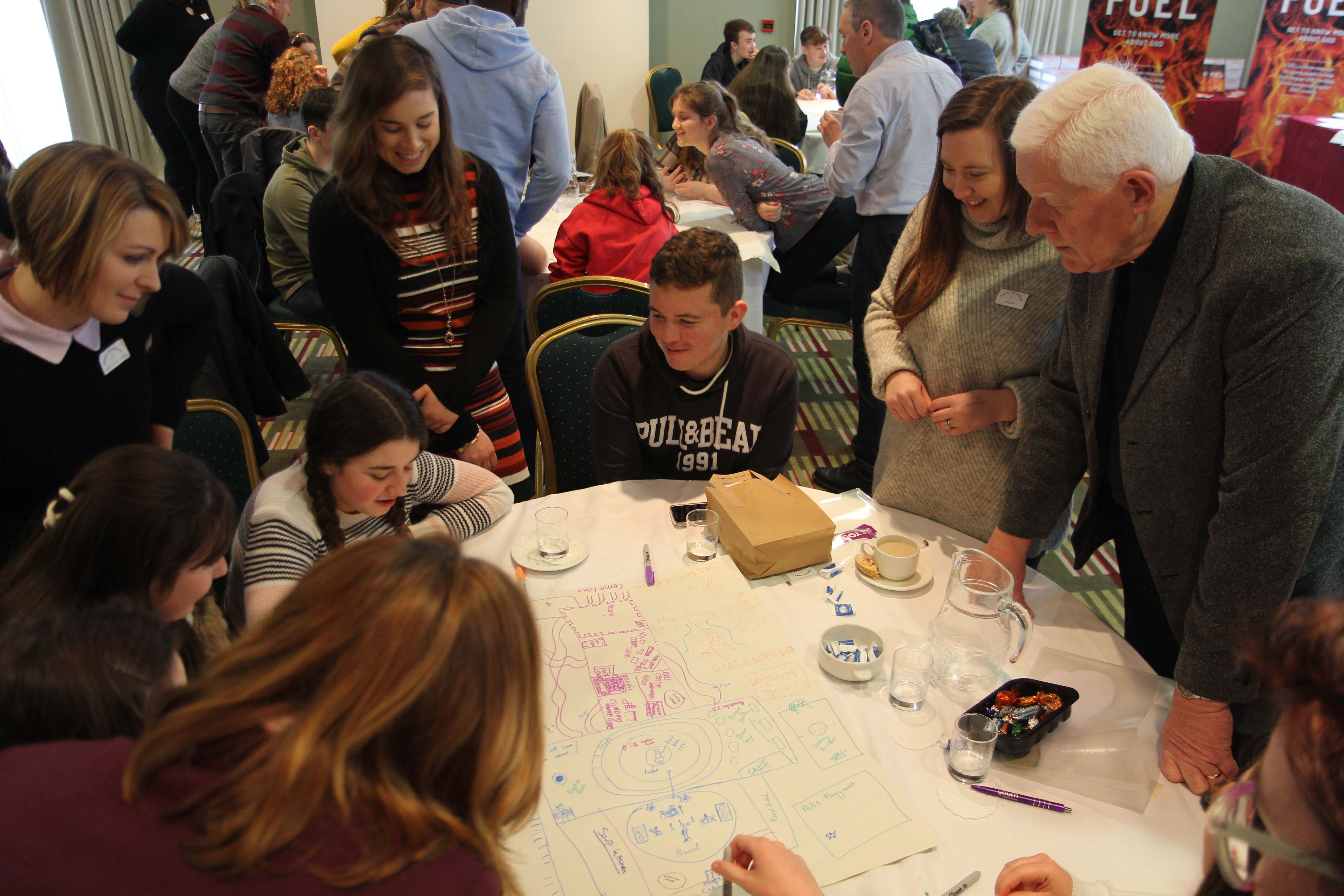Some of the young diocesan representatives at the Church of Ireland Youth Forum explain their ideas for church design to the youth leaders.