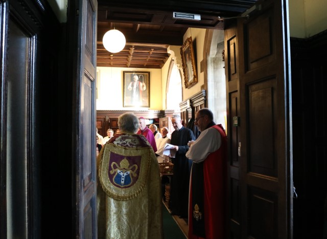 Clergy gather in the robing room before the service.
