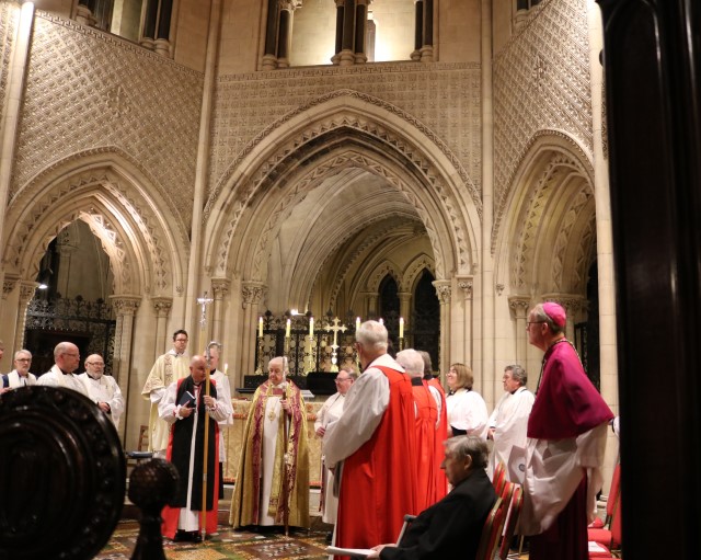 The new Bishop is presented with his staff.