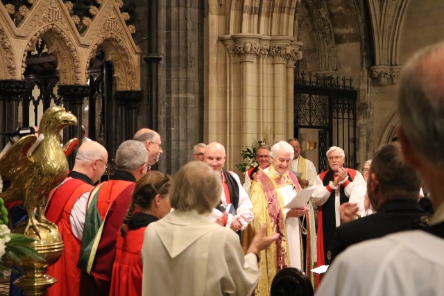 The new Bishop is presented to, and welcomed by, the congregation.