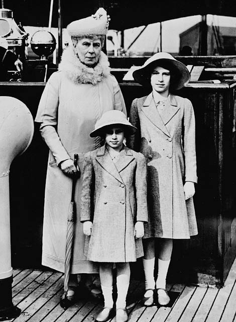 Princess Elizabeth with Queen Mary and Princess Margaret on a tour of London's dockyard area, May 1939. Photo credit: Library and Archives Canada.