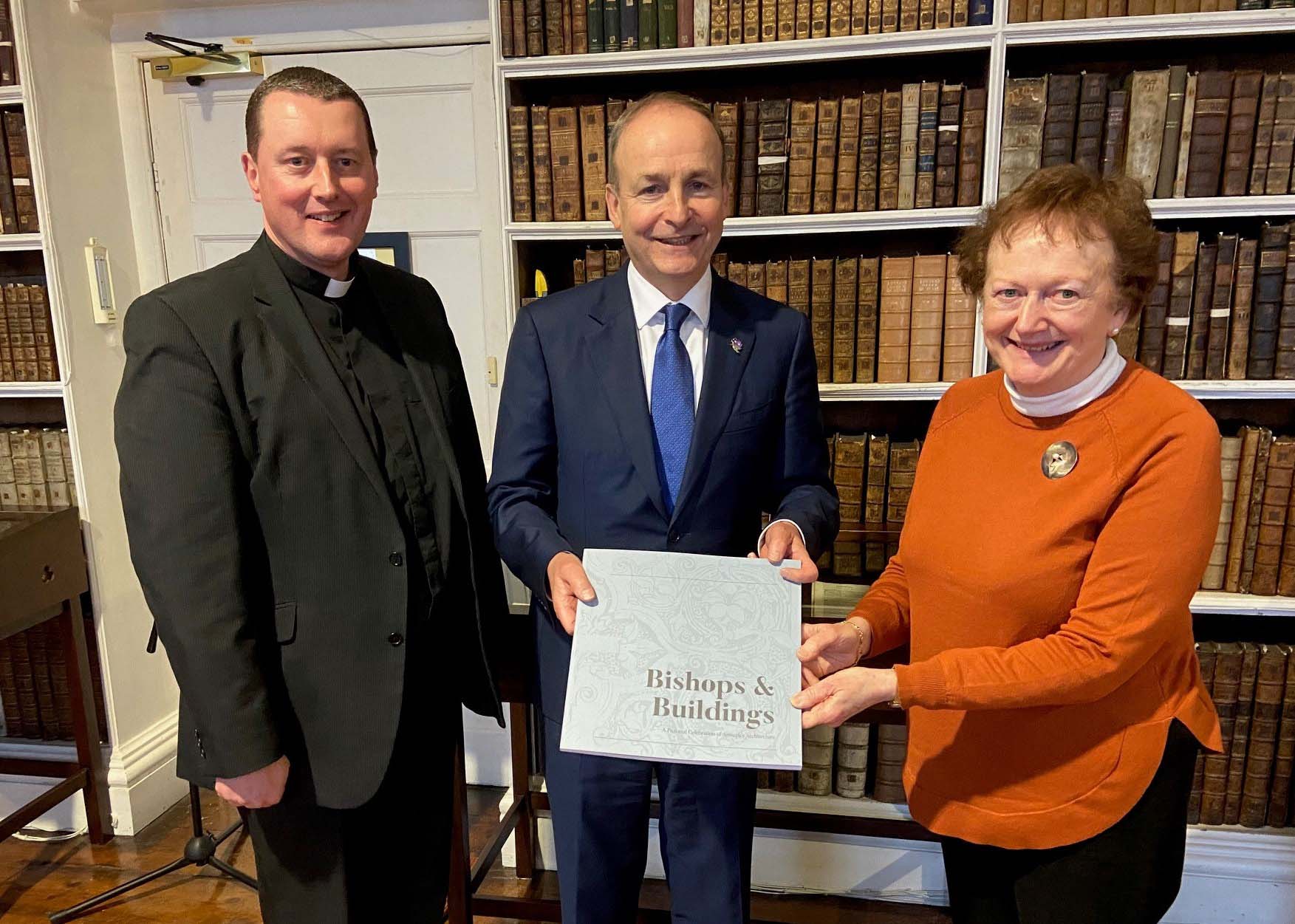 The Tánaiste with the Very Revd Shane Forster, Keeper of Armagh Robinson Library, and Ms Carol Conlin, Assistant Keeper.
